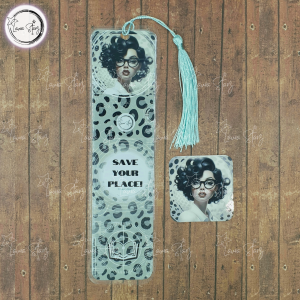 Book mark with a lady with black bob wearing glasses at top of book mark and leopard print design under the picture